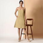 Front View of a Model wearing Khaki Sage Cotton Flax Strappy Slit Dress