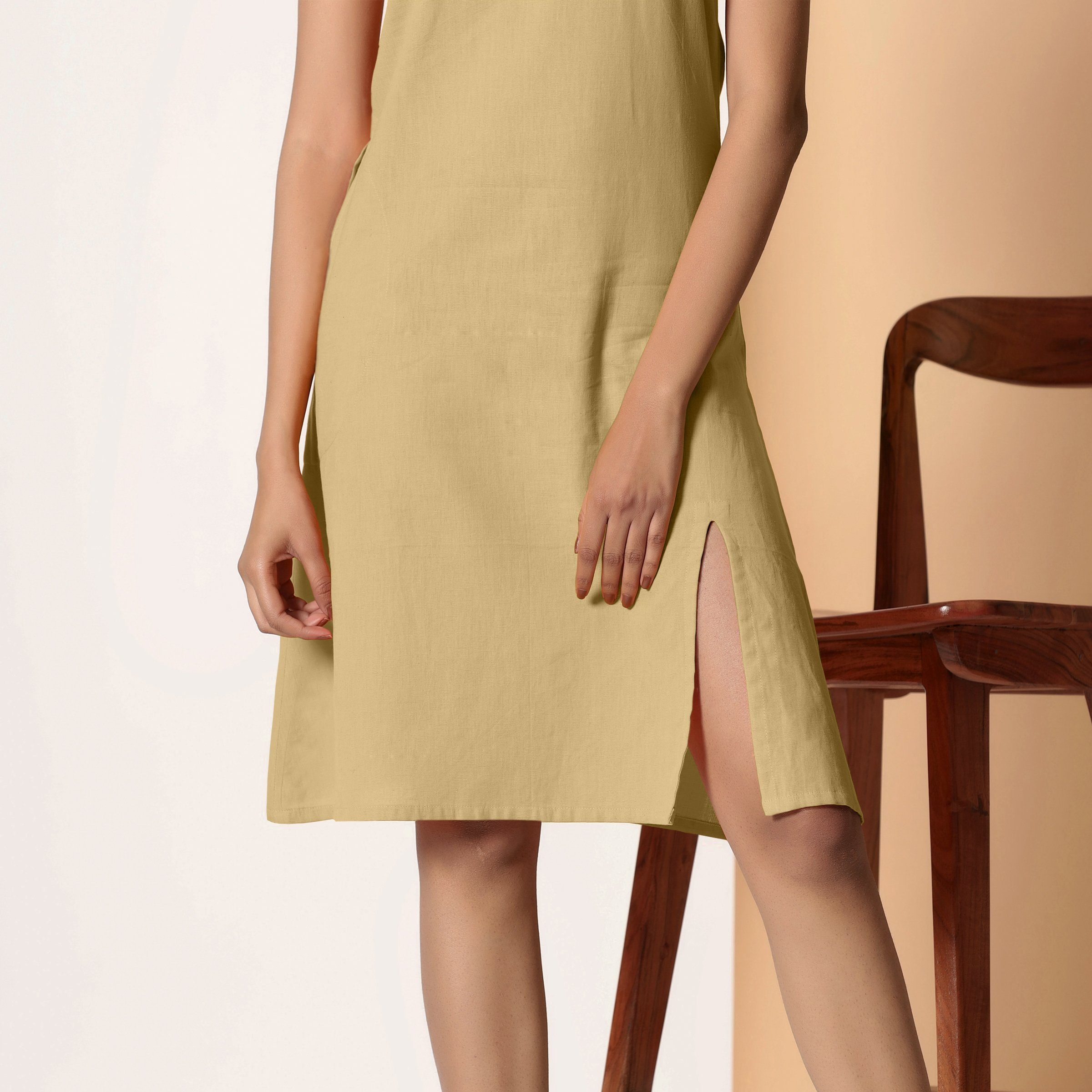 Front Detail of a Model wearing Khaki Sage Cotton Flax Strappy Slit Dress