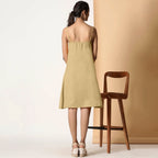 Back View of a Model wearing Khaki Sage Cotton Flax Strappy Slit Dress