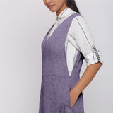 Left Detail of a Model wearing Lavender 100% Linen V-Neck Midi Pinafore Dress