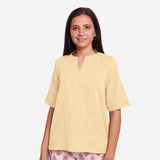 Front View of a Model wearing Lemon Yellow Yarn Dyed Cotton High-Low Top