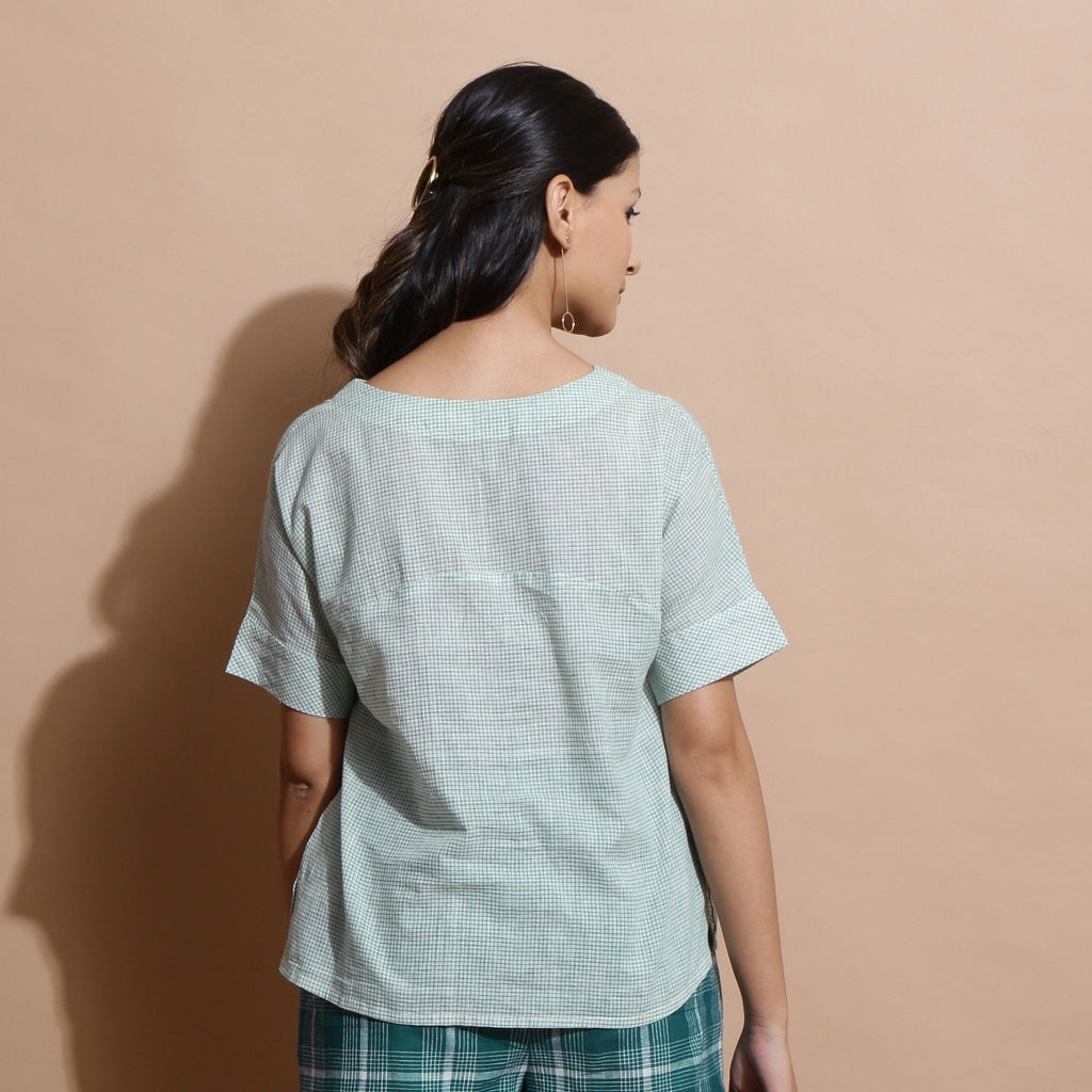 Back View of a Model wearing Light Green Checks Handspun Cotton Muslin V-Neck Top