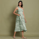 Right View of a Model wearing Light Green Shibori One-Shoulder Midi Dress