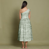 Back View of a Model wearing Light Green Shibori One-Shoulder Midi Dress