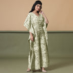 Right View of a Model wearing Light Green Shibori V-Neck Cotton Kaftan Jumpsuit