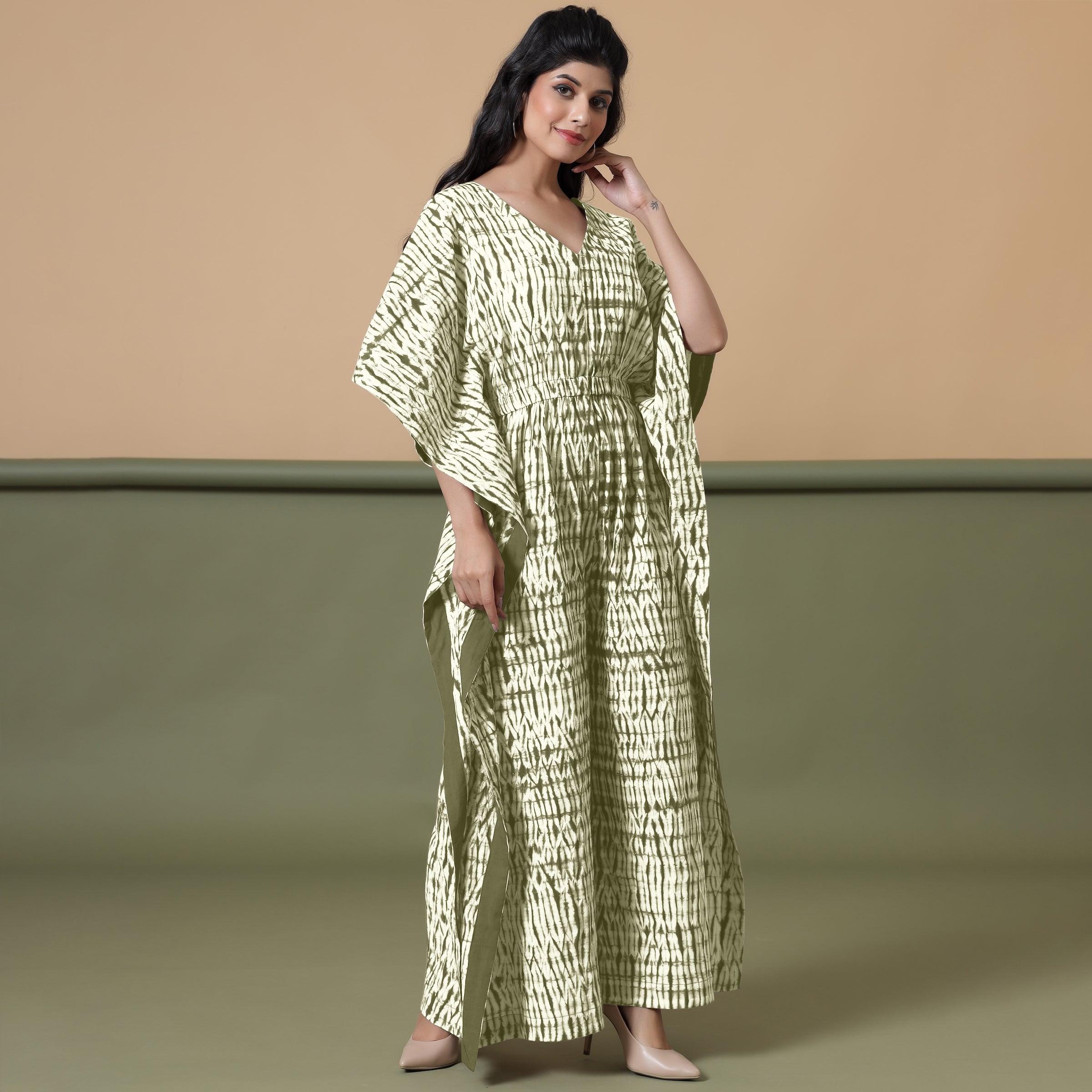Right View of a Model wearing Light Green Shibori V-Neck Cotton Kaftan Jumpsuit