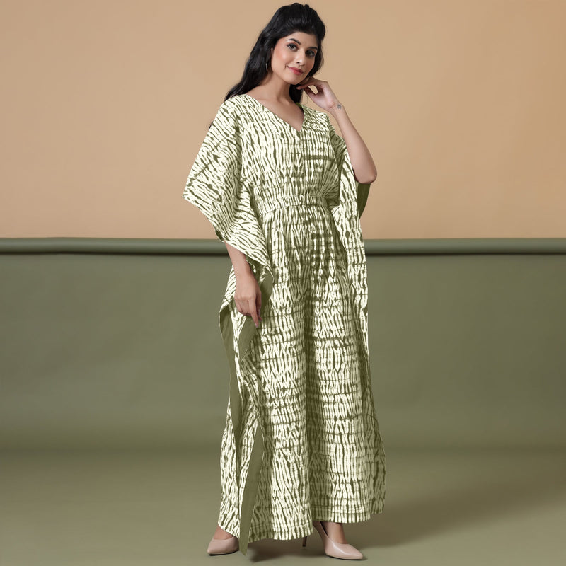 Right View of a Model wearing Light Green Shibori V-Neck Cotton Kaftan Jumpsuit