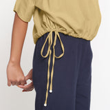 Right View of a Model wearing Light Khaki Cotton Flax Blouson Top