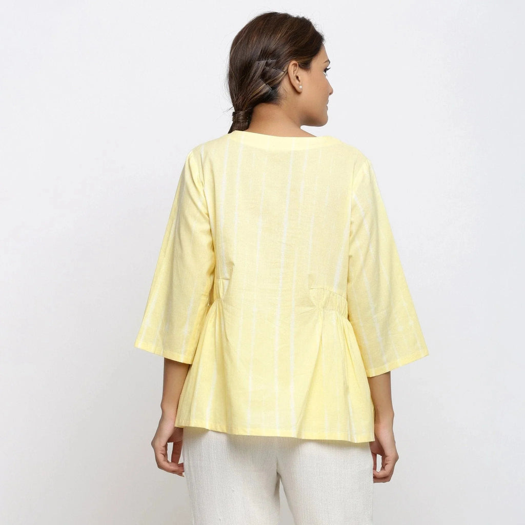 Back View of a Model wearing Light Yellow Cotton Button-Down Top