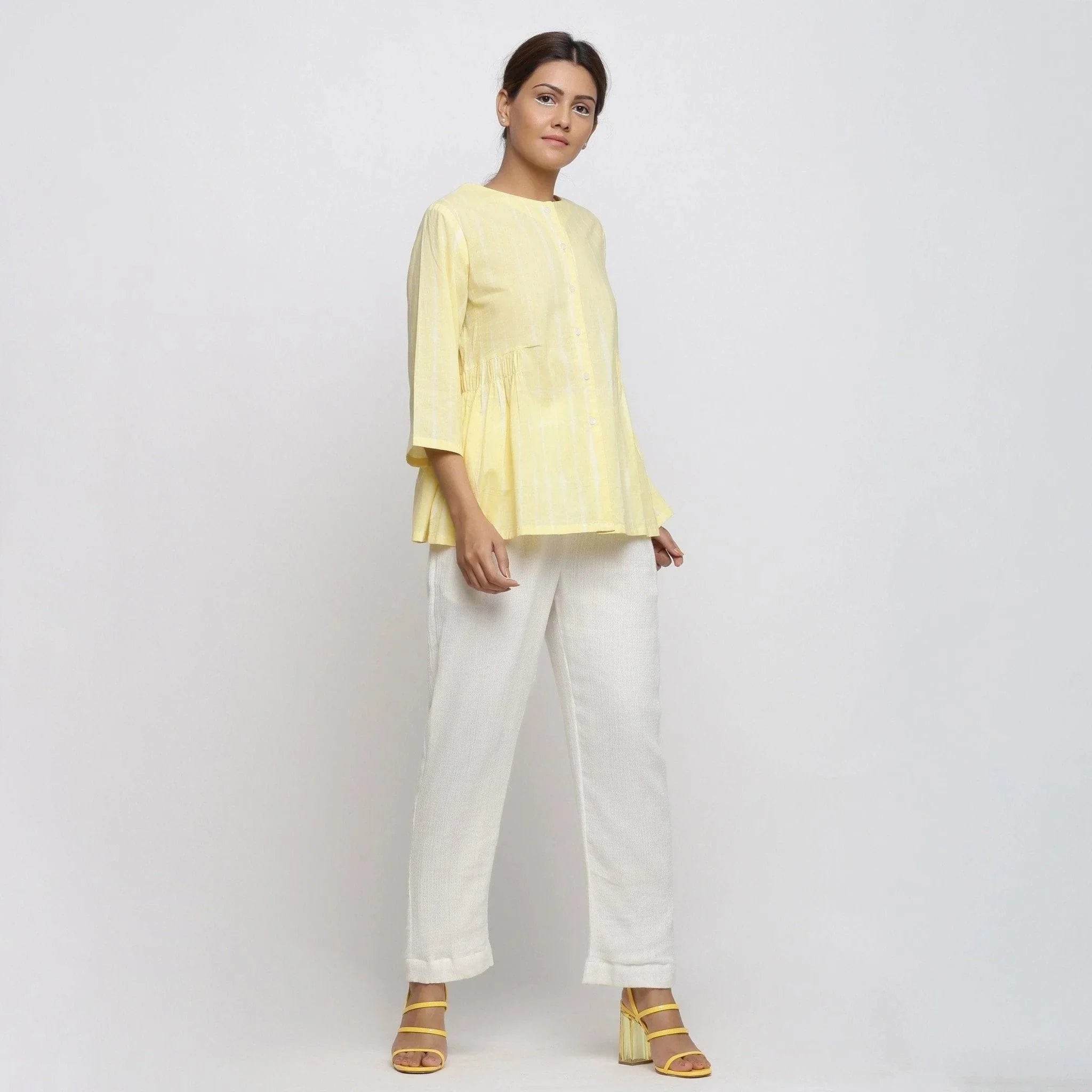 Right View of a Model wearing Light Yellow Cotton Button-Down Top