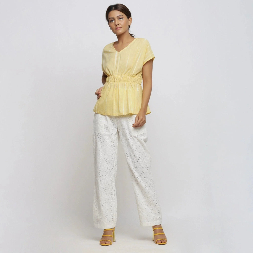 Front View of a Model wearing Light Yellow Hand Tie Dye Blouson Top