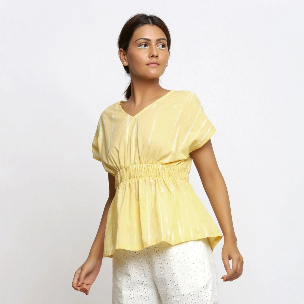 Front View of a Model wearing Light Yellow Hand Tie Dye Blouson Top