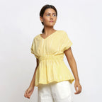 Front View of a Model wearing Light Yellow Hand Tie Dye Blouson Top
