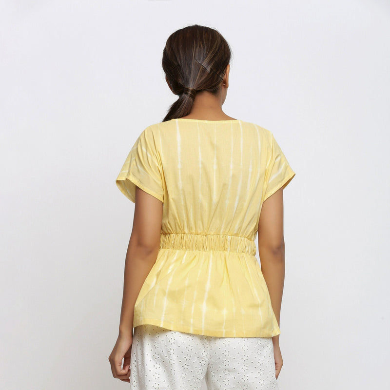Back View of a Model wearing Light Yellow Hand Tie Dye Blouson Top