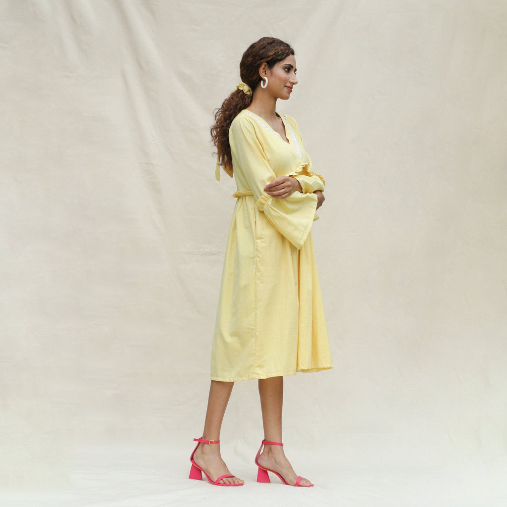 Right View of a Model wearing Light Yellow Handspun Cotton Bohemian Midi Dress