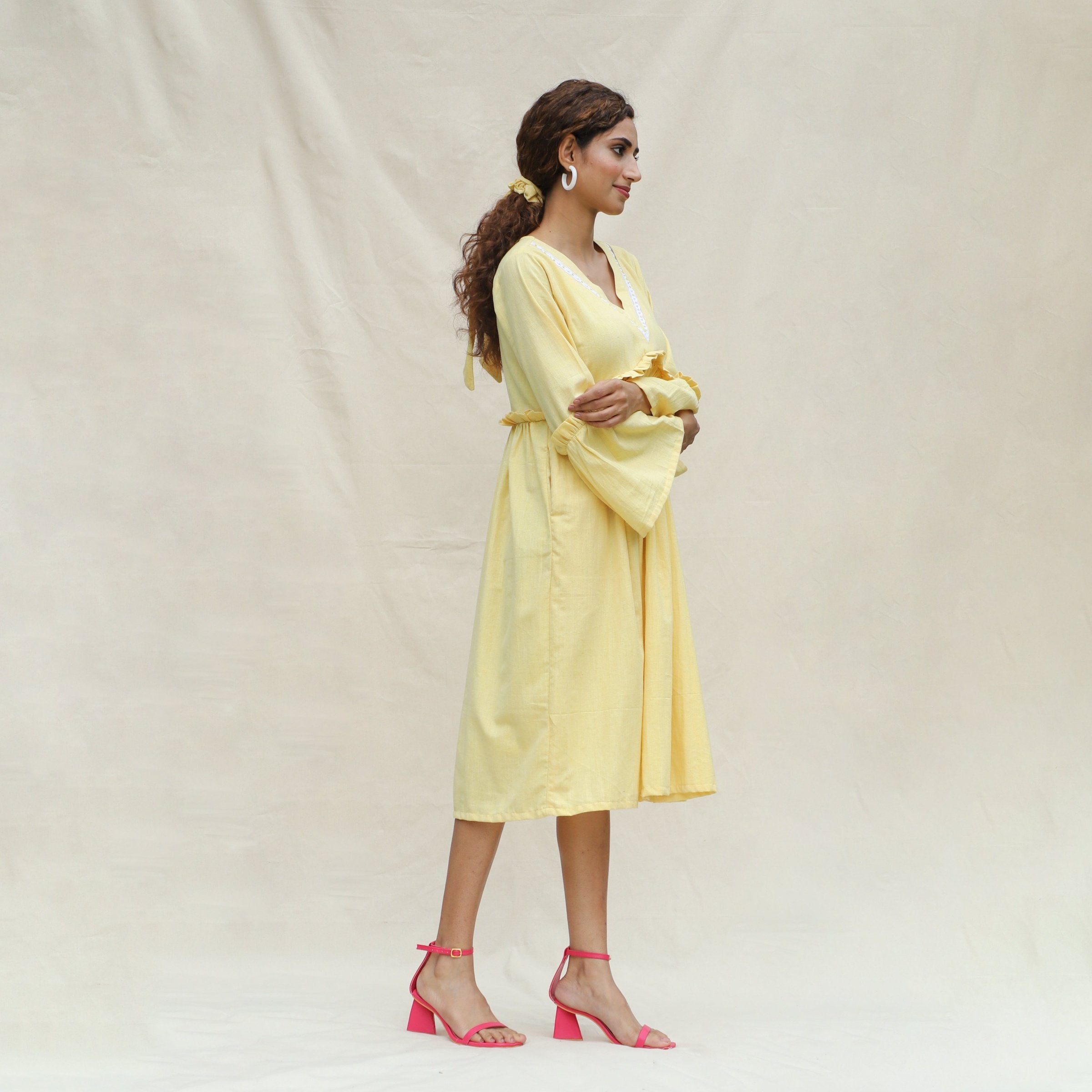 Right View of a Model wearing Light Yellow Handspun Cotton Bohemian Midi Dress