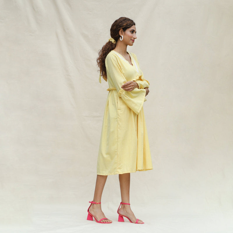 Right View of a Model wearing Light Yellow Handspun Cotton Bohemian Midi Dress