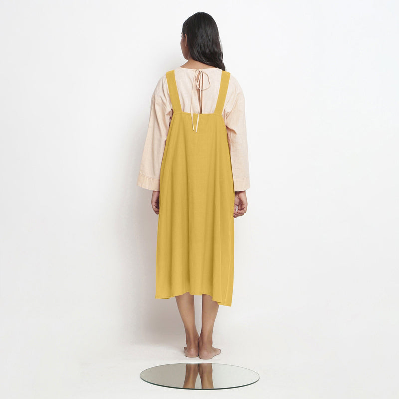 Back View of a Model wearing Light Yellow Handspun Cotton Deep Neck Shift Dress