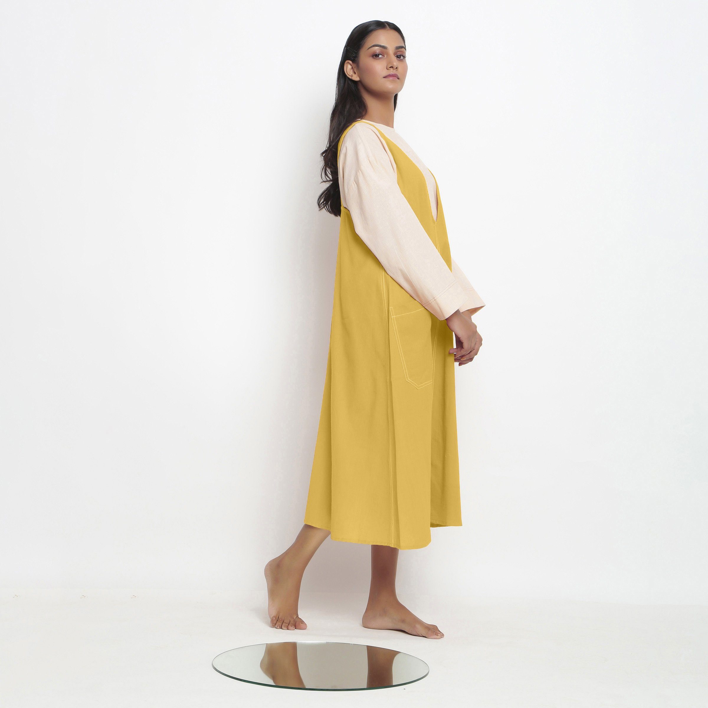 Right View of a Model wearing Light Yellow Handspun Cotton Deep Neck Shift Dress
