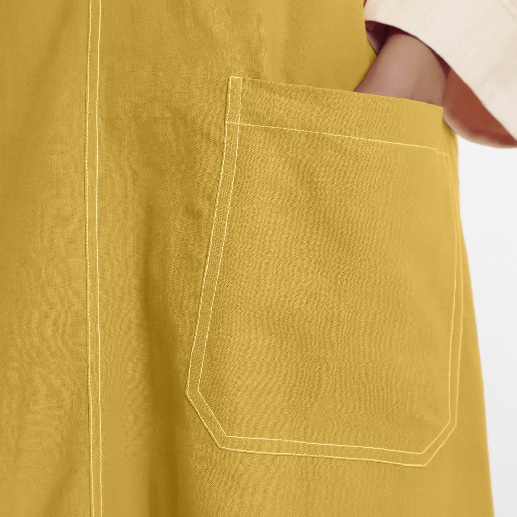 Close View of a Model wearing Light Yellow Handspun Cotton Deep Neck Shift Dress
