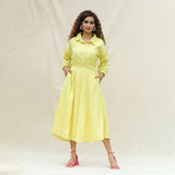 Front View of a Model wearing Light Yellow Handspun Cotton Yoked Button-Down Midi Dress