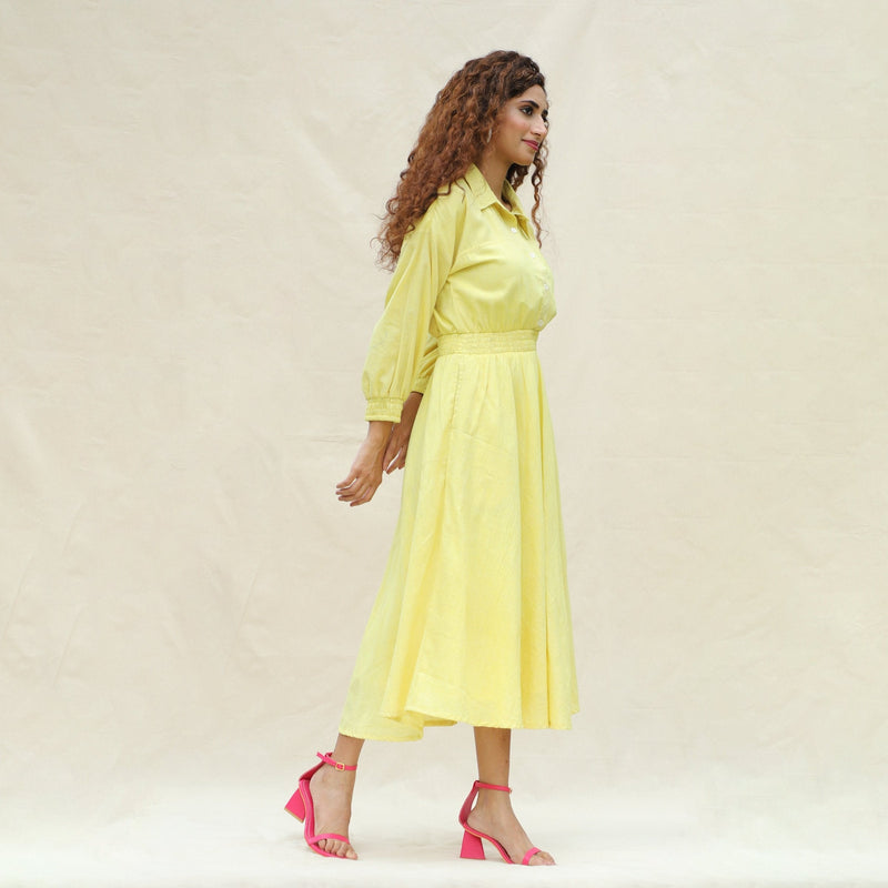 Right View of a Model wearing Light Yellow Handspun Cotton Yoked Button-Down Midi Dress