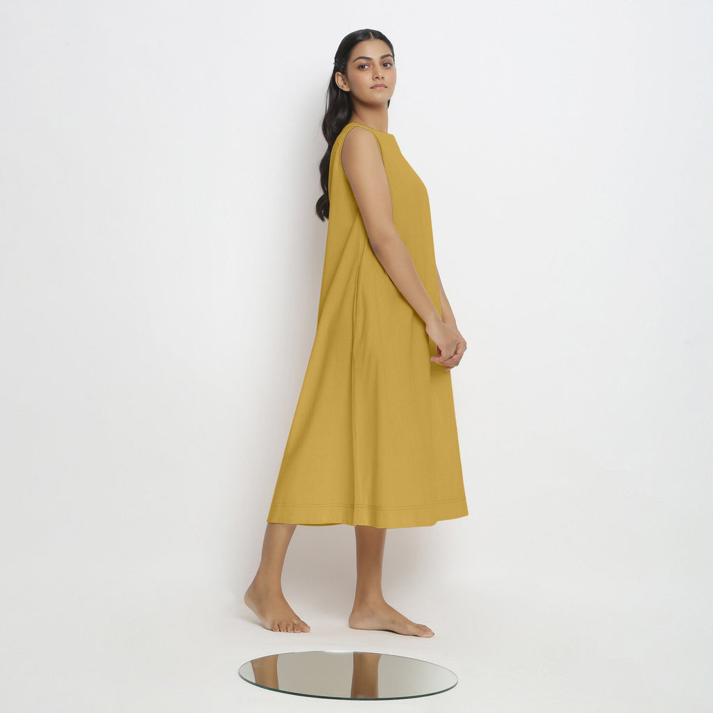 Right View of a Model wearing Light Yellow Vegetable Dyed A-Line Paneled Dress