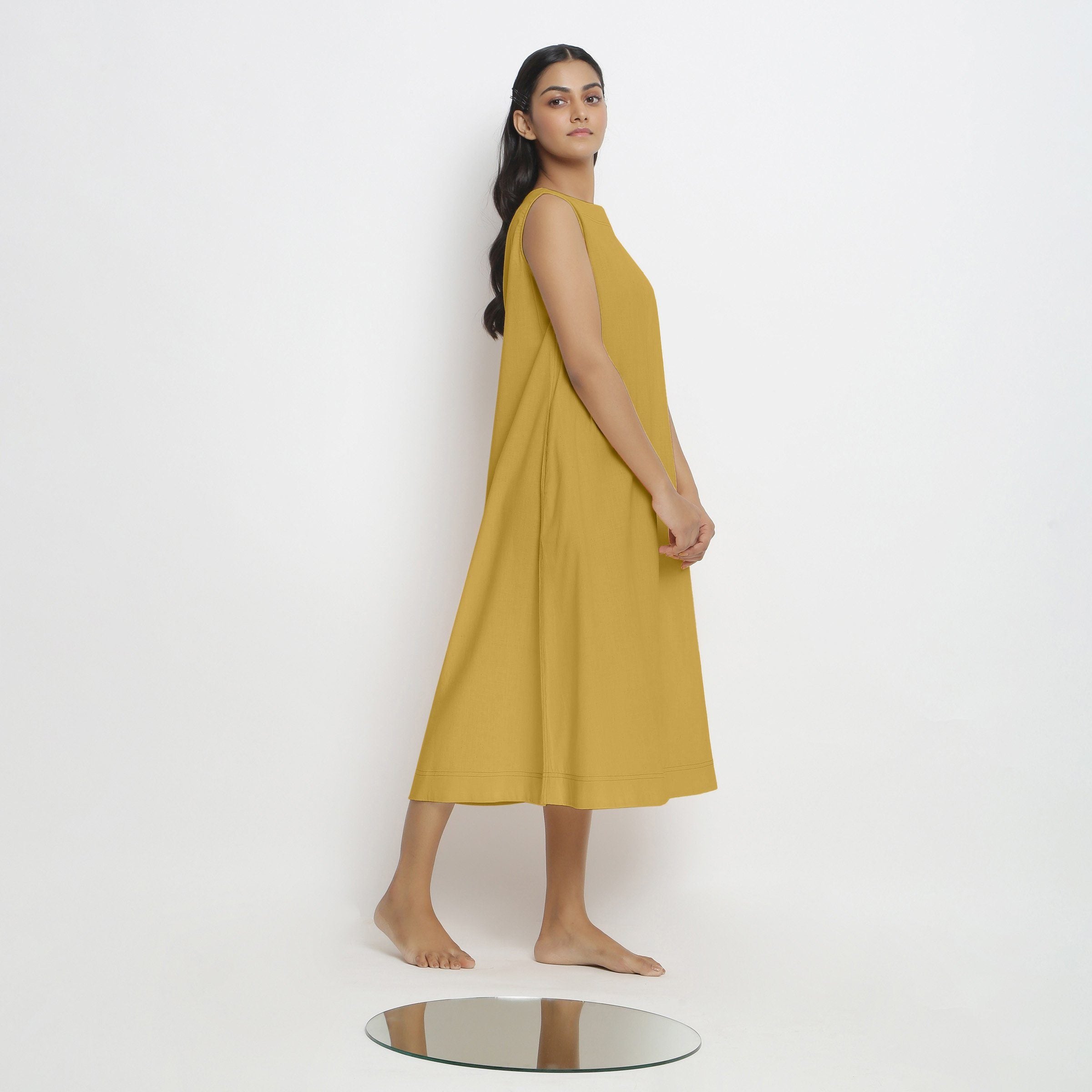 Right View of a Model wearing Light Yellow Vegetable Dyed A-Line Paneled Dress