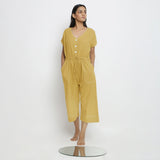 Front View of a Model wearing Light Yellow Vegetable Dyed Button-Down Jumpsuit