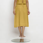 Back View of a Model wearing Light Yellow Vegetable Dyed Button-Down Skirt