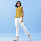 Left View of a Model wearing Light Yellow Vegetable Dyed Handspun Cotton Essential Top