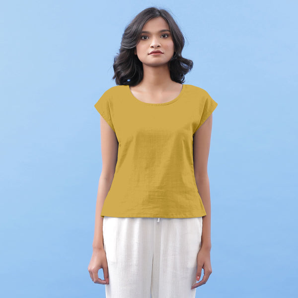 Front View of a Model wearing Light Yellow Vegetable Dyed Handspun Cotton Essential Top