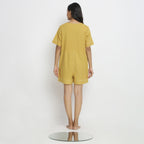 Back View of a Model wearing Light Yellow Vegetable Dyed Romper