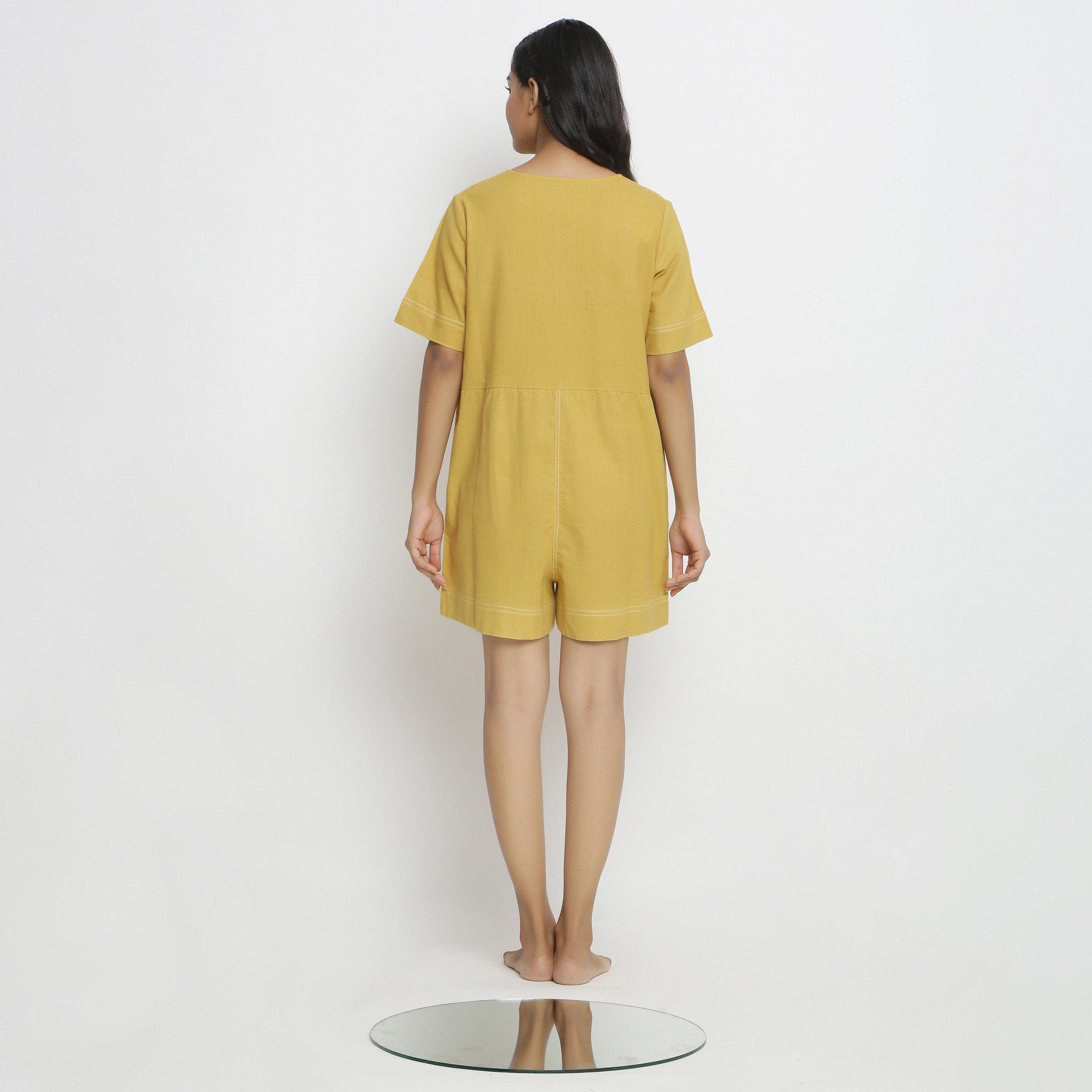 Back View of a Model wearing Light Yellow Vegetable Dyed Romper