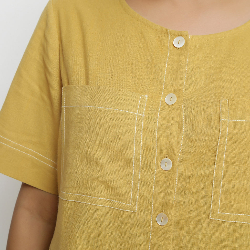 Front Detail of a Model wearing Light Yellow Vegetable Dyed Romper
