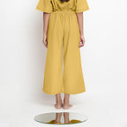 Back View of a Model wearing Light Yellow Vegetable Dyed Wide Legged Pant