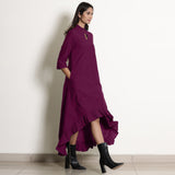 Right View of a Model wearing Magenta Frilled Neck High Low Dress