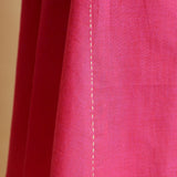 Close View of a Model wearing Magenta Hand-Embroidered Godet Dress