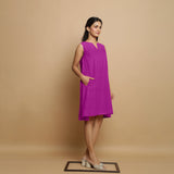 Right View of a Model wearing Magenta Linen Embroidered Knee-Length Godet Dress