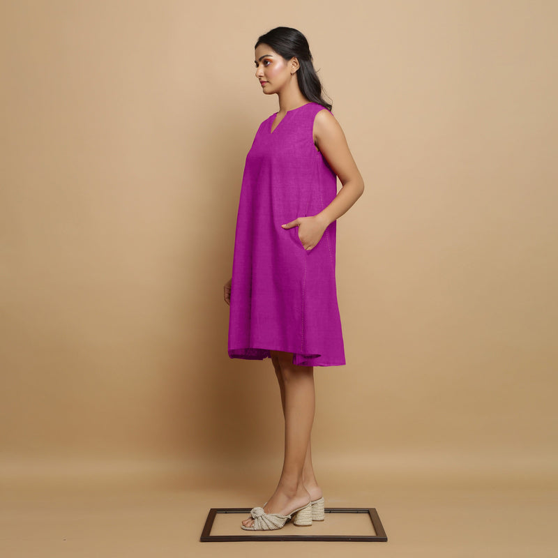 Left View of a Model wearing Magenta Linen Embroidered Knee-Length Godet Dress