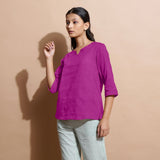 Left View of a Model wearing Magenta 100% Linen Split-Neck Tunic Top