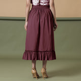 Back View of a Model wearing Maroon A-Line Ruffled Cotton Skirt