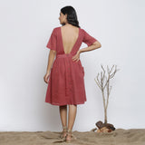 Back View of a Model wearing Maroon Backless Fit and Flare Dress