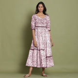 Front View of a Model wearing Maroon Shibori Asymmetrical Tier Maxi Dress