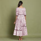 Back View of a Model wearing Maroon Shibori Asymmetrical Tier Maxi Dress
