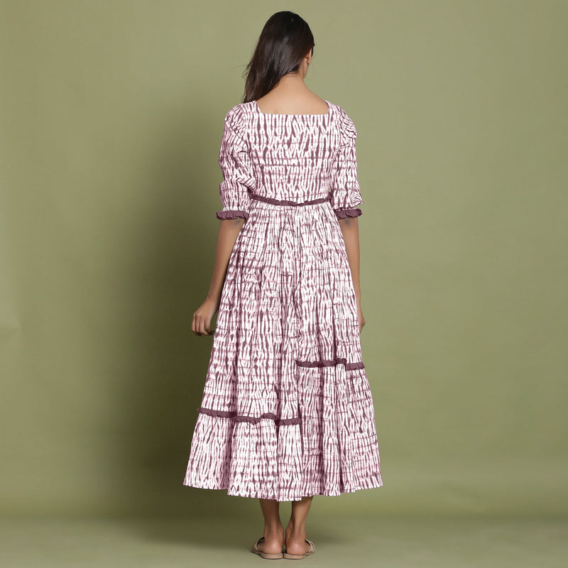 Back View of a Model wearing Maroon Shibori Asymmetrical Tier Maxi Dress