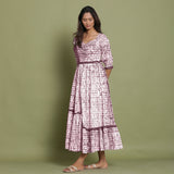 Left View of a Model wearing Maroon Shibori Asymmetrical Tier Maxi Dress