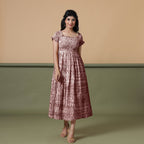 Front View of a Model wearing Maroon Shibori Elasticated Gathered Dress