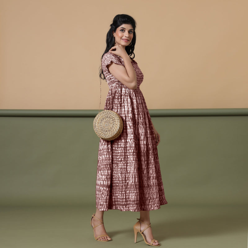 Right View of a Model wearing Maroon Shibori Elasticated Gathered Dress