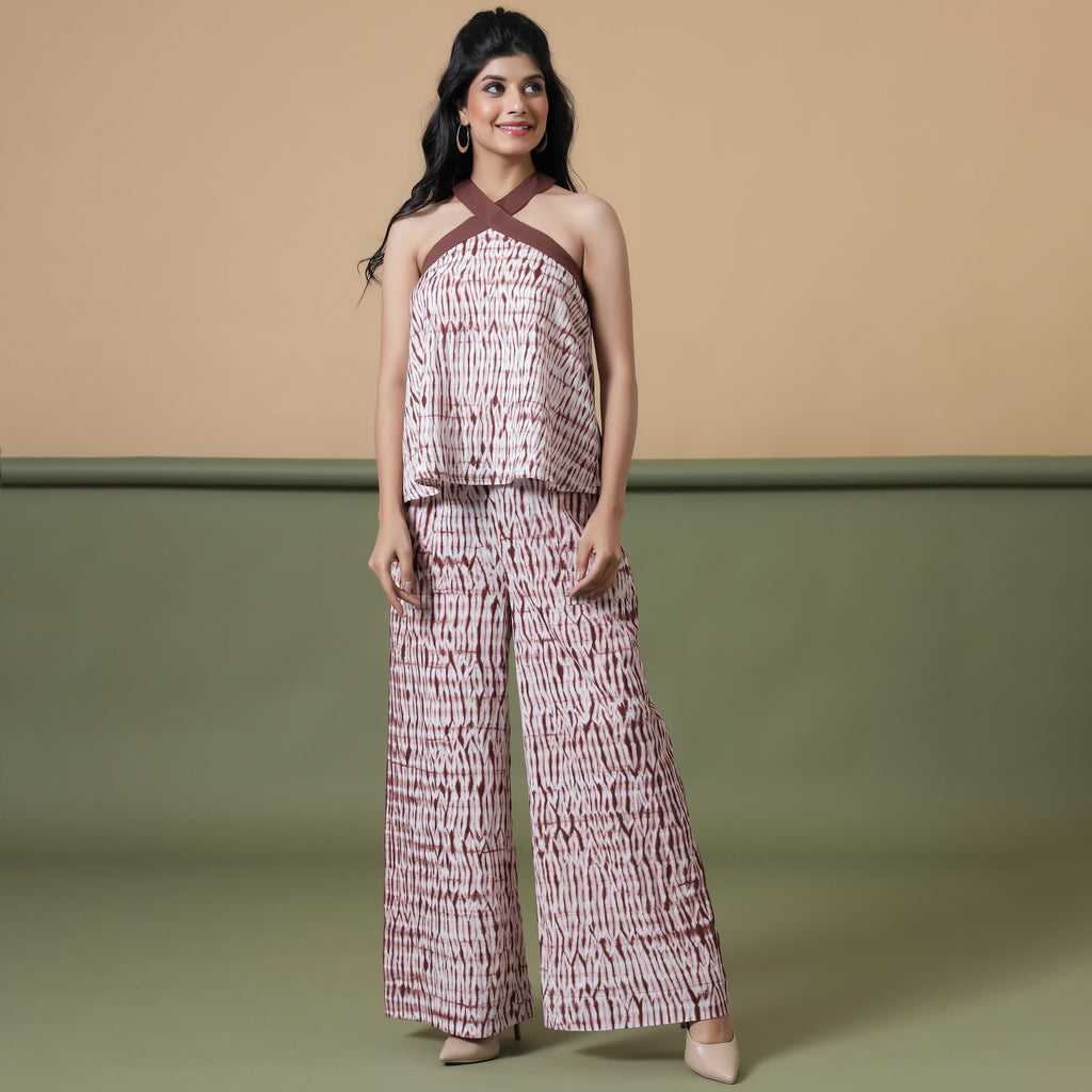 Front View of a Model wearing Maroon Shibori Tie-Dye Cotton Halter Neck Flared Top